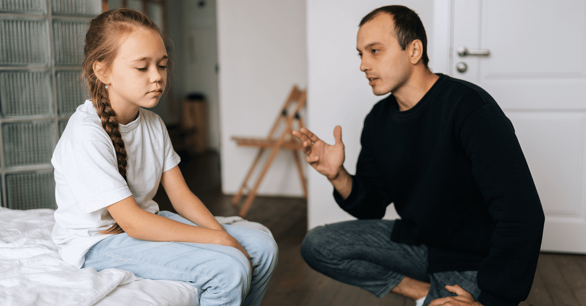 concerned parent talking to worried child about divorce