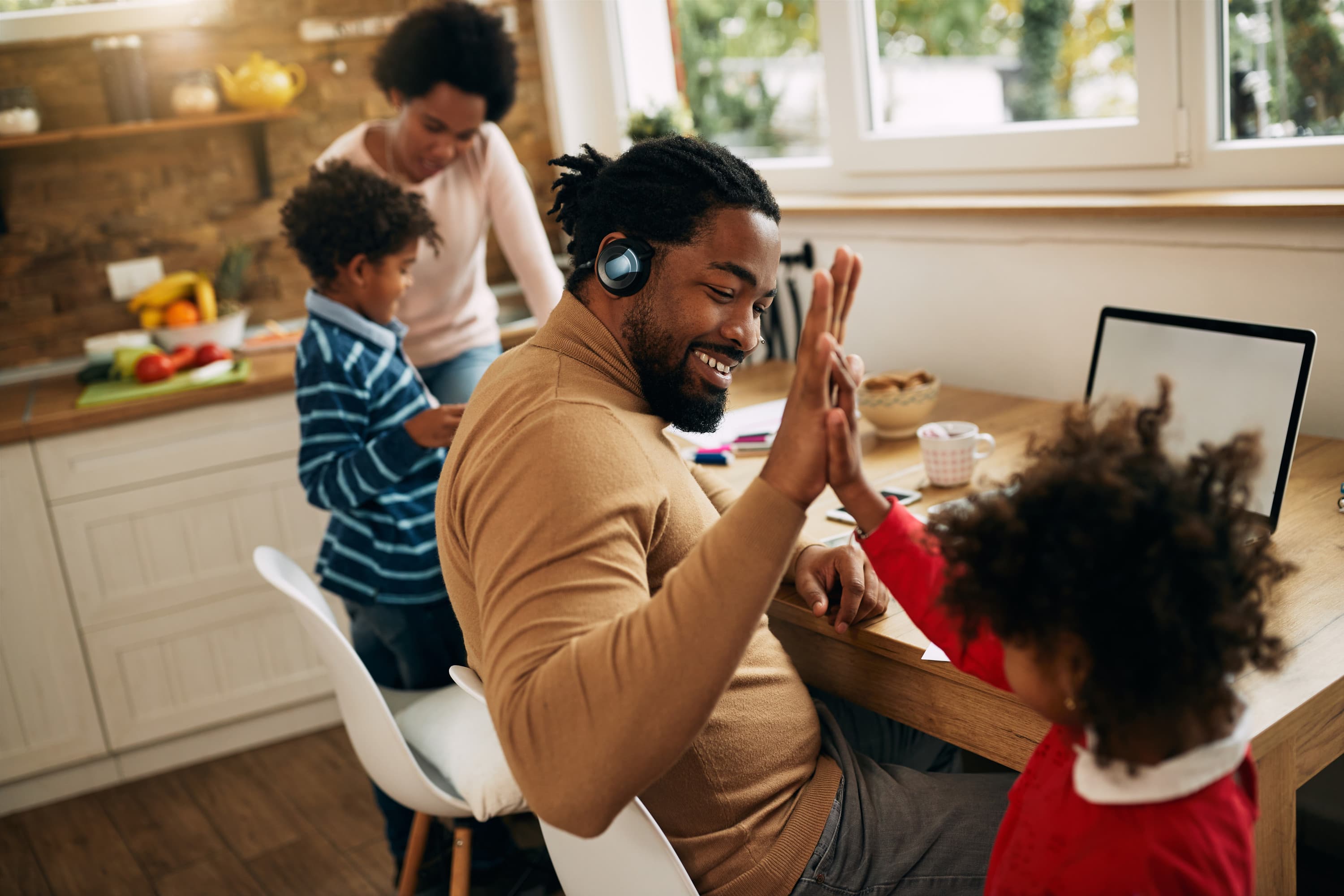 parent giving their child a high-five